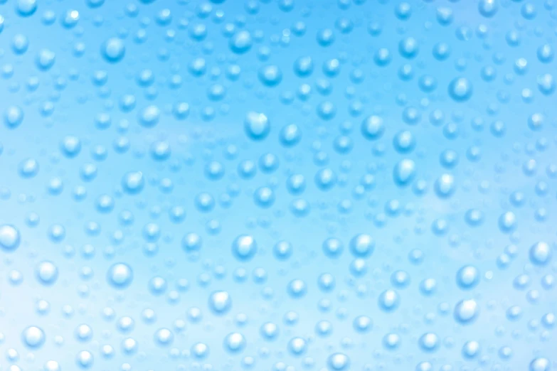 some rain drops on a blue sky