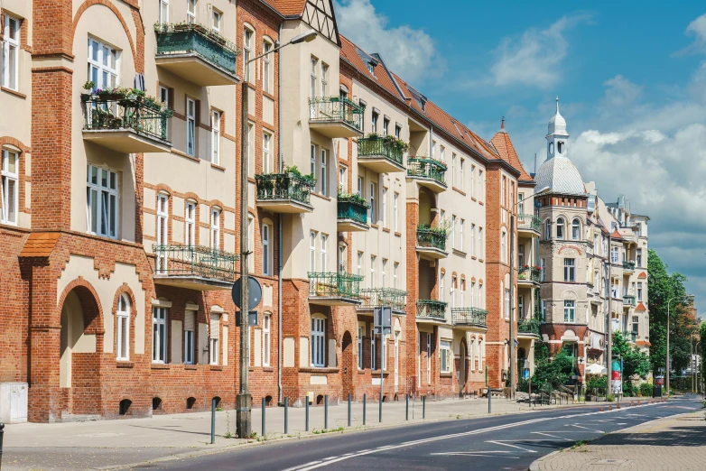 an older row of buildings sit along a street