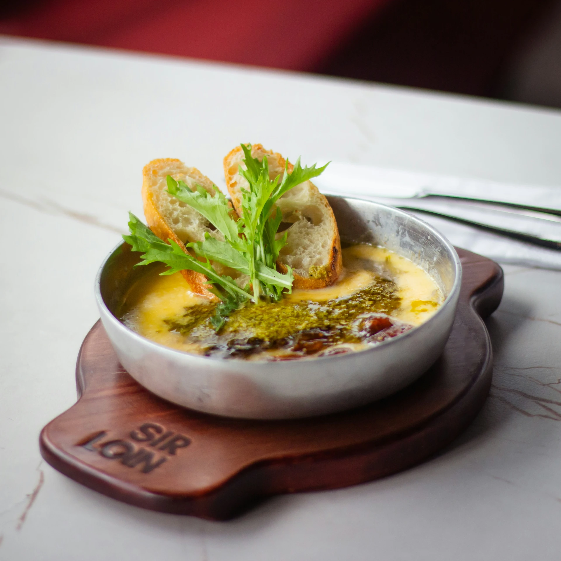 a bowl filled with soup and garnished vegetables