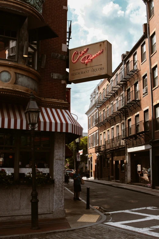 a tall brick building has been named o & o on the corner