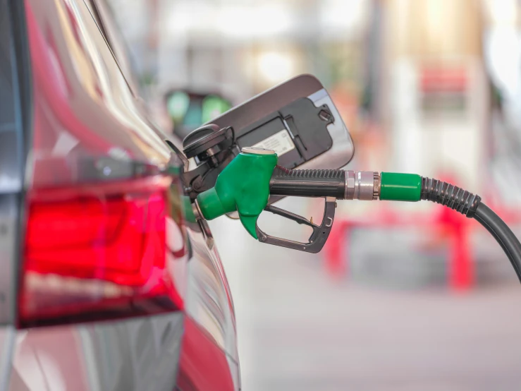 fuel is at the pump for cars at a gas station