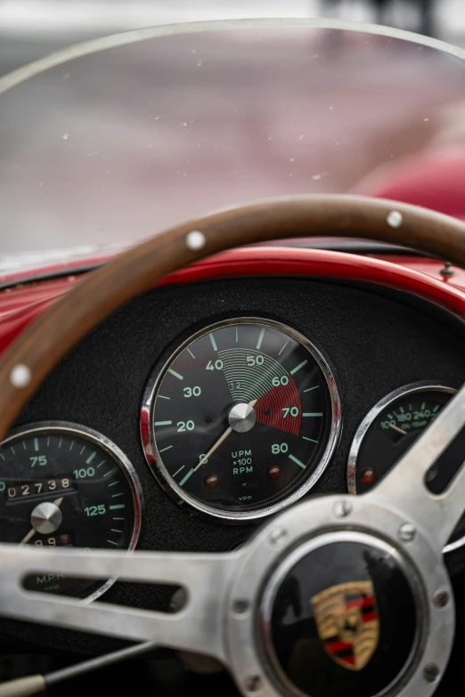 a close up s of the dash on a classic car