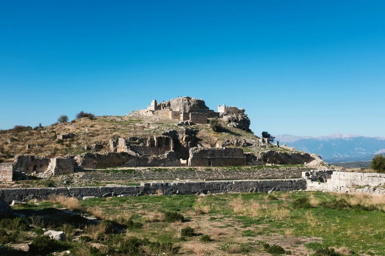 a stone building with multiple terraces on it