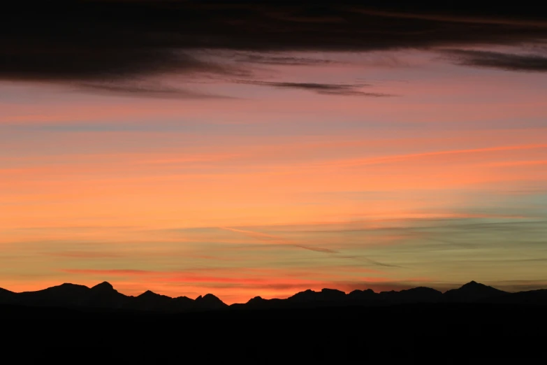 a sunset view of the mountains in colorado