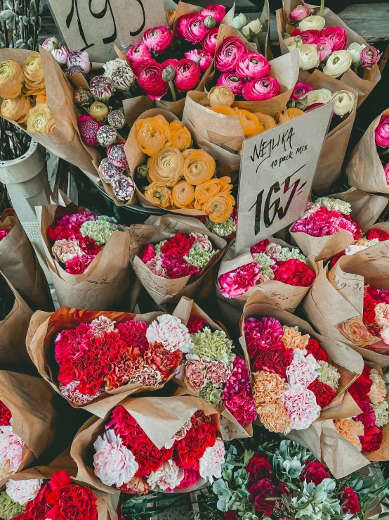 a lot of paper flowers that are on display