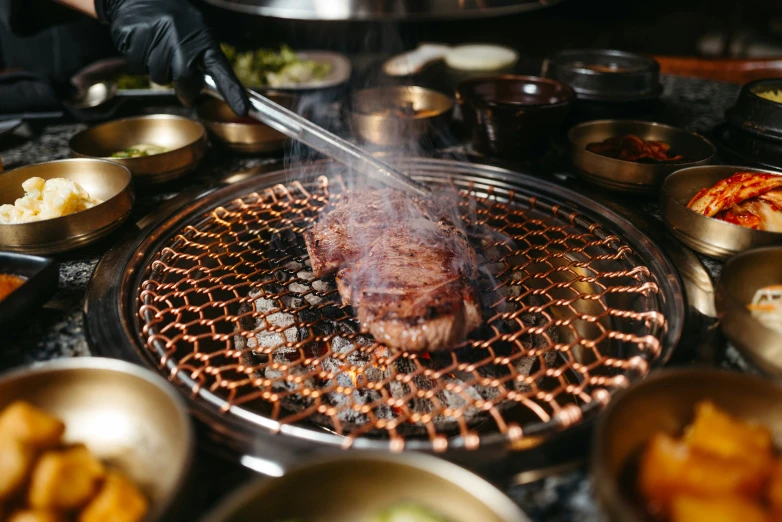 the food is being grilled on the grill to make them melt