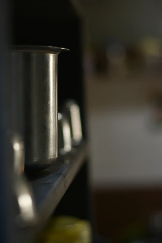 close up of a shelf with a cup on top
