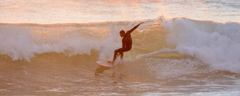 a person that is surfing on some waves