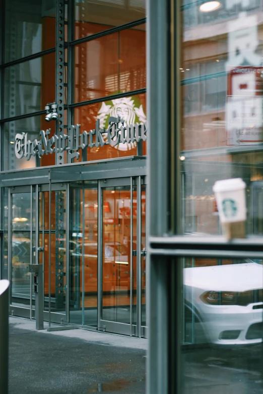 the glass entrance to a business is partially closed