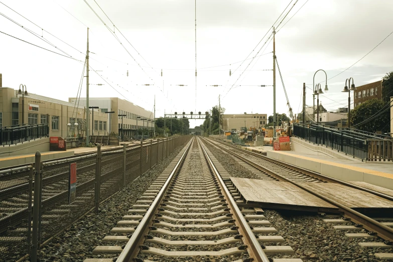 a large train track next to a building