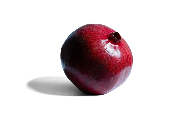 a single, shiny red apple is shown against a white background