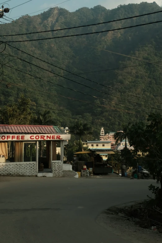 a building with the sign coffee corner stands out on the street