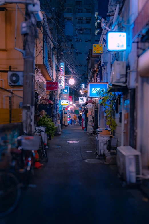 an alley is filled with buildings and people walking through the alleyway
