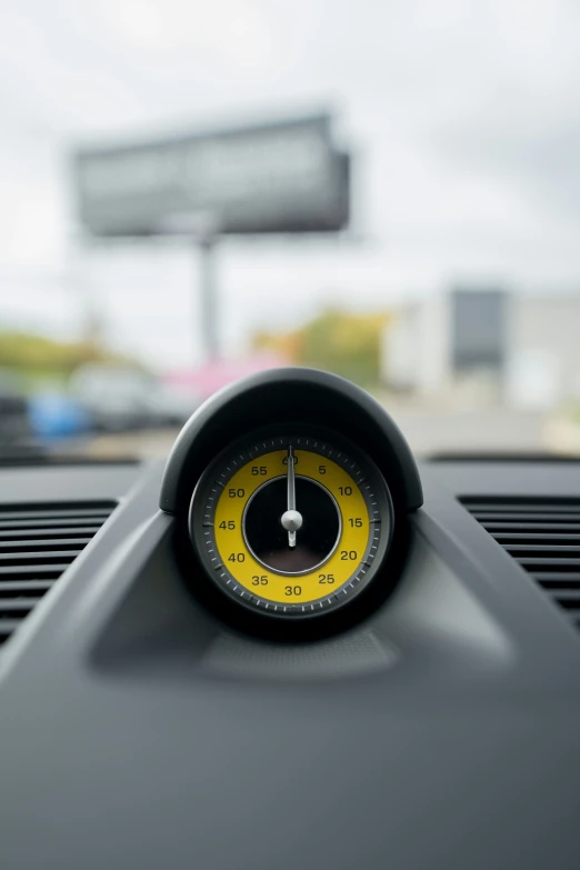 a meter is sitting on a vehicle dashboard