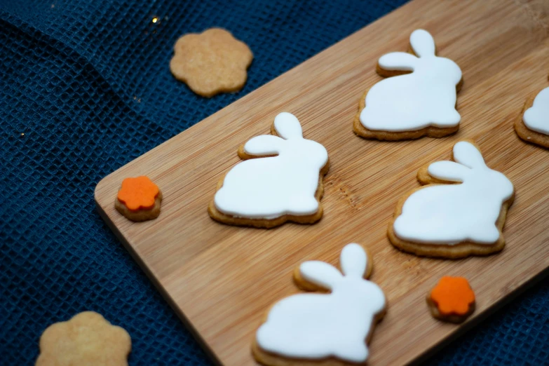 cookies decorated with white frosting and colored pee - dogs