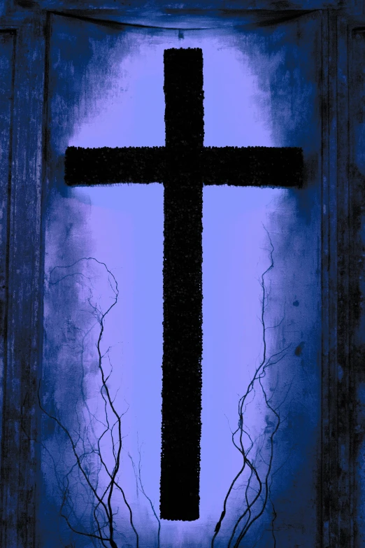 a cross in a window with blue skies behind it