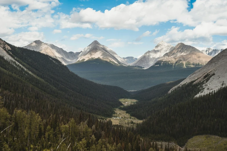 there are several snow covered mountains on the side