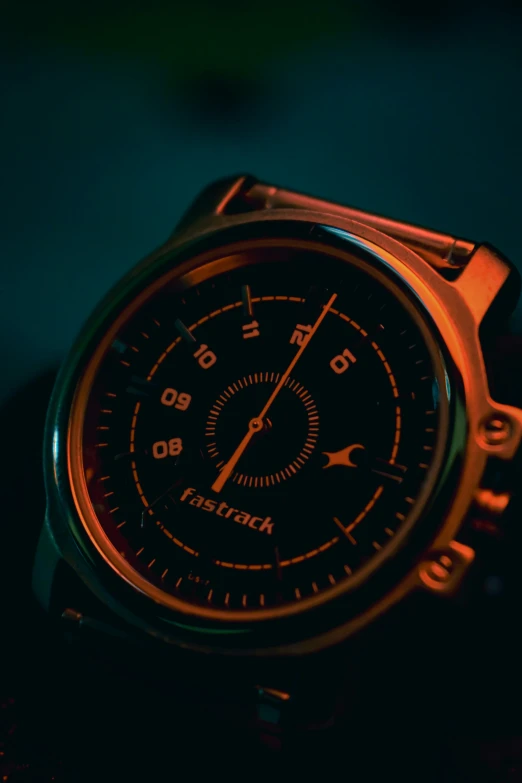 the close up view of a watch shows its glowing colors