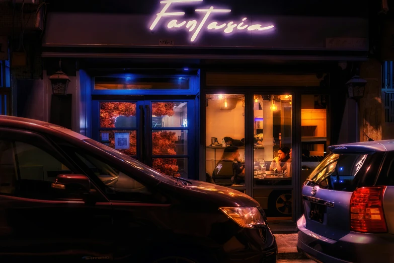 a group of cars parked in front of a shop