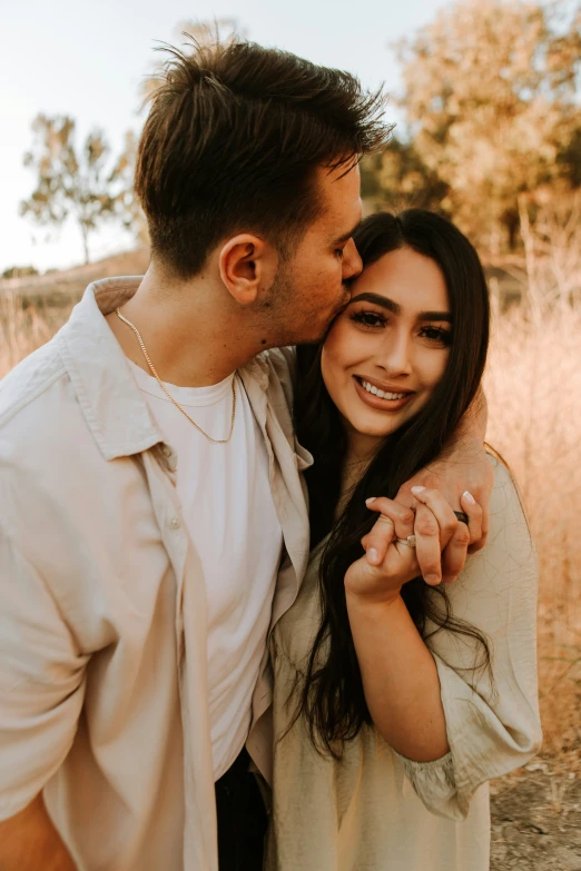 a man and woman smiling while posing for a po