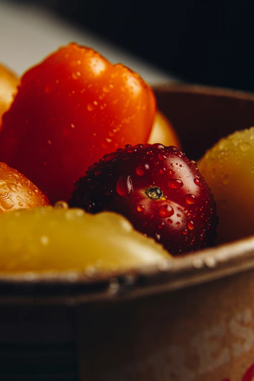 several different types of fruit are inside of a cup