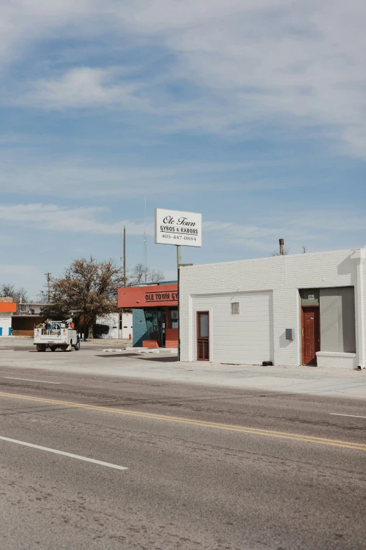 an empty parking lot on a street in a rural area