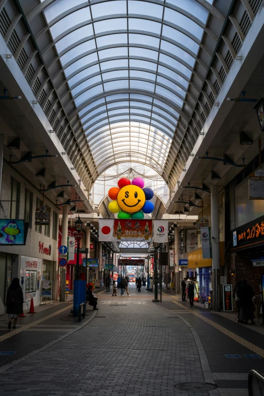 there is a smile balloon hanging from the ceiling