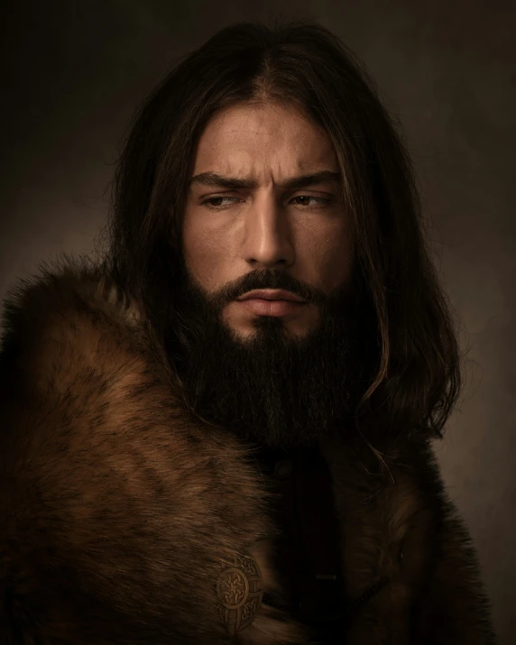 a bearded man wearing fur with long hair and a beard