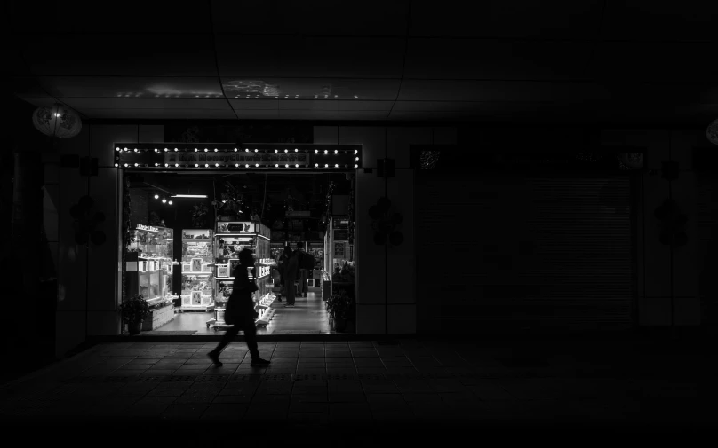 an open door with lights that are glowing in the dark