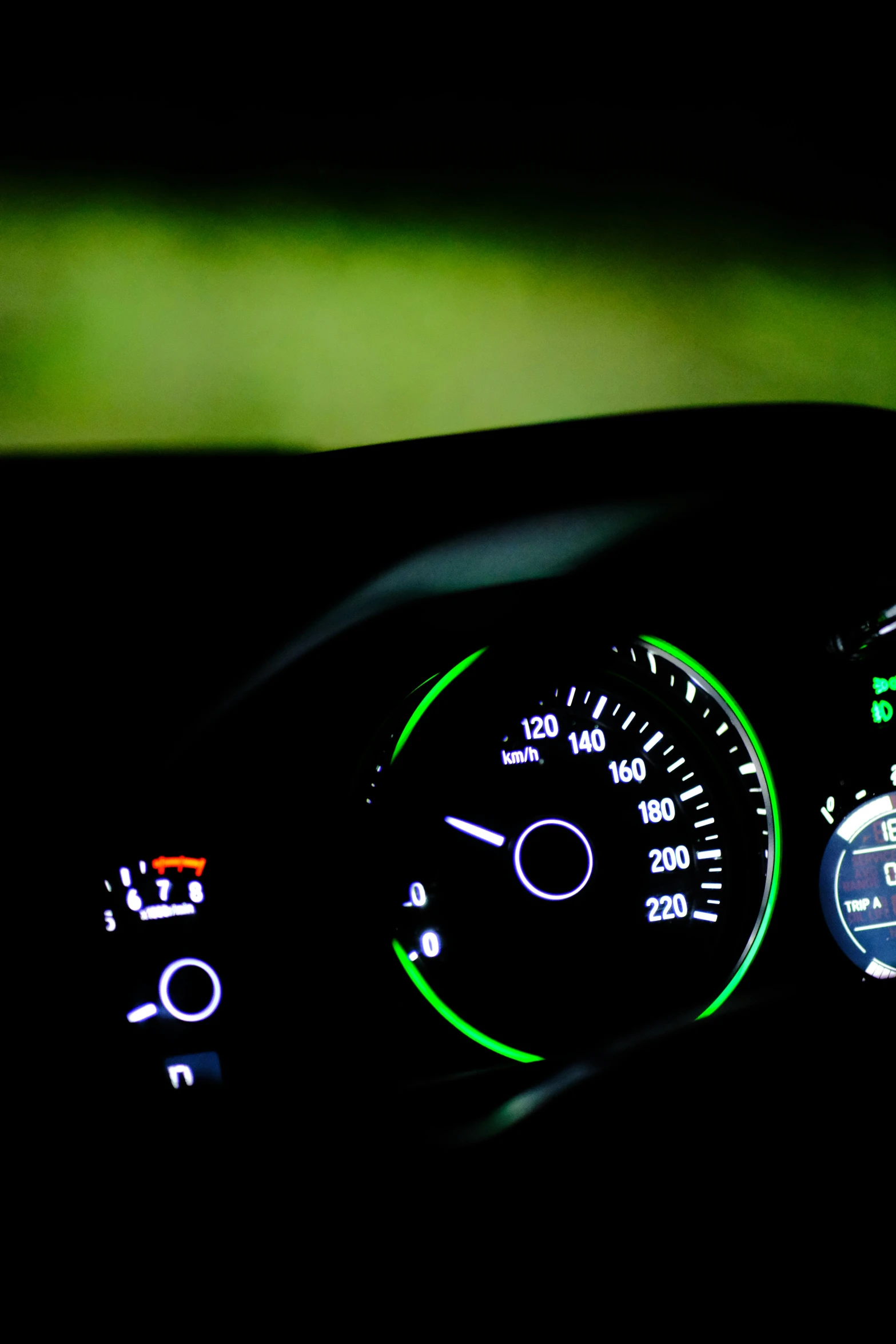 the dashboard light of a car in the dark