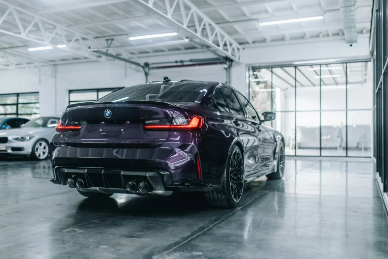 a car in a showroom with its lights on