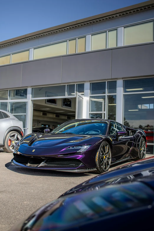 two cars parked outside of a building with a reflection