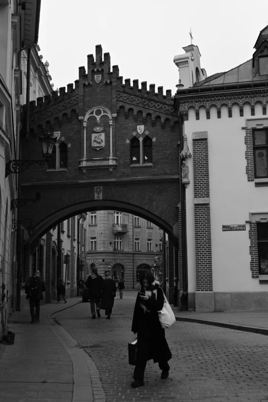 a large brick bridge over some very pretty buildings