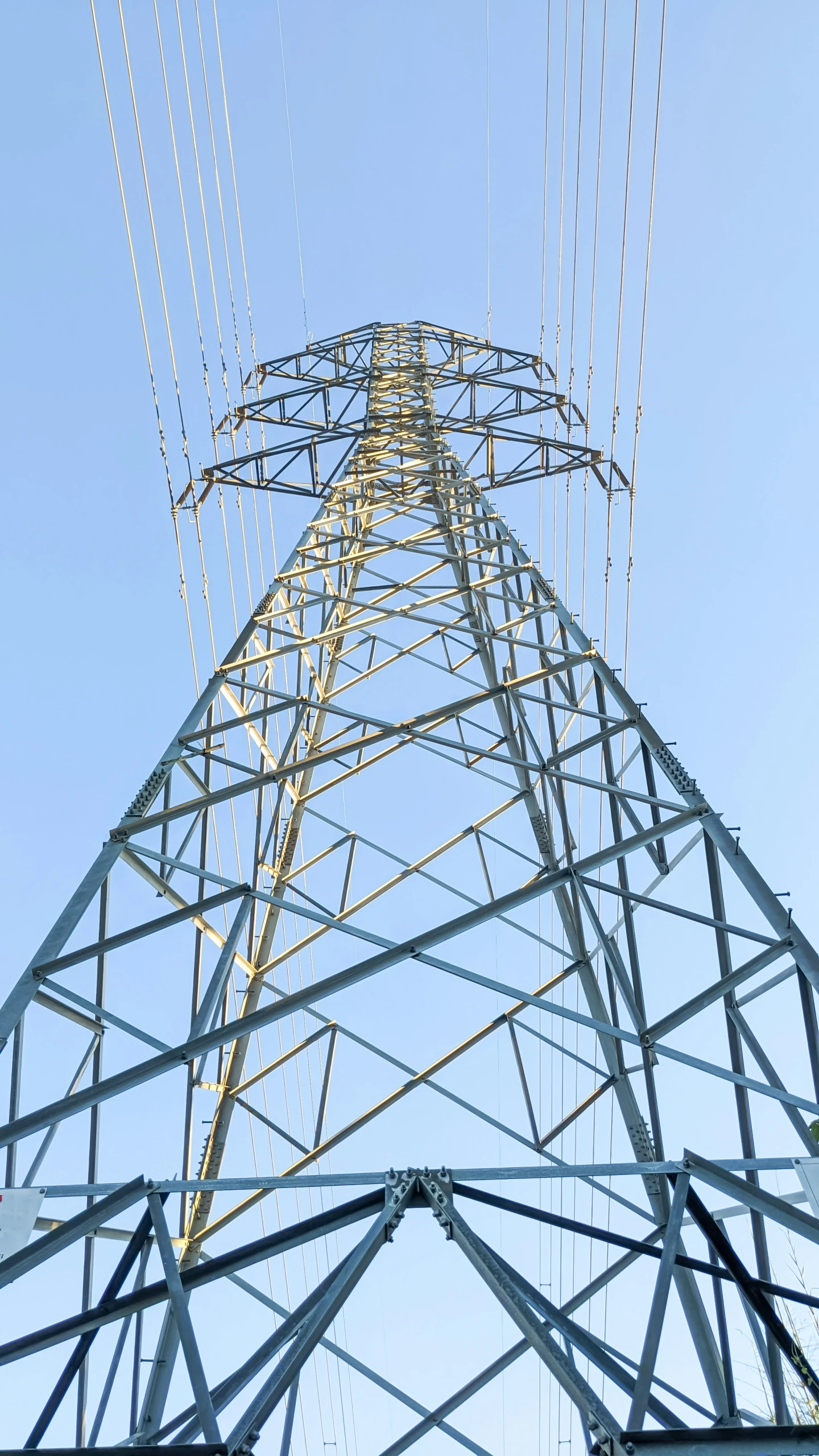 a high voltage power plant tower with electricity lines