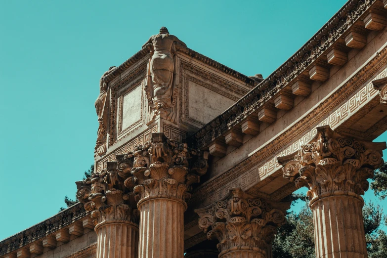 an ornate structure against a light blue sky