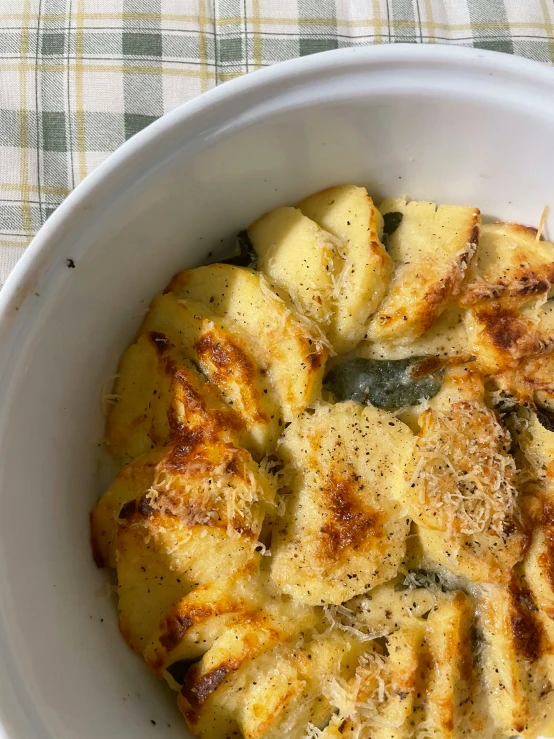 a white bowl with some food inside it