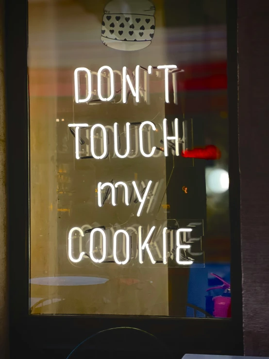 a lighted sign that reads don't touch my cookie