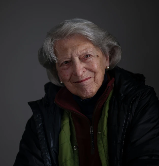 the older woman is posing for a portrait