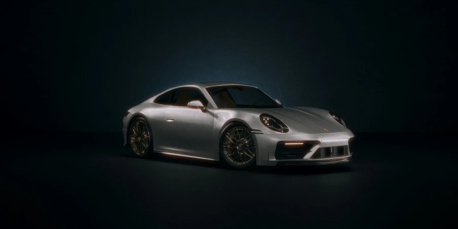 a silver car in a dark room, it looks like the front end of a porsche