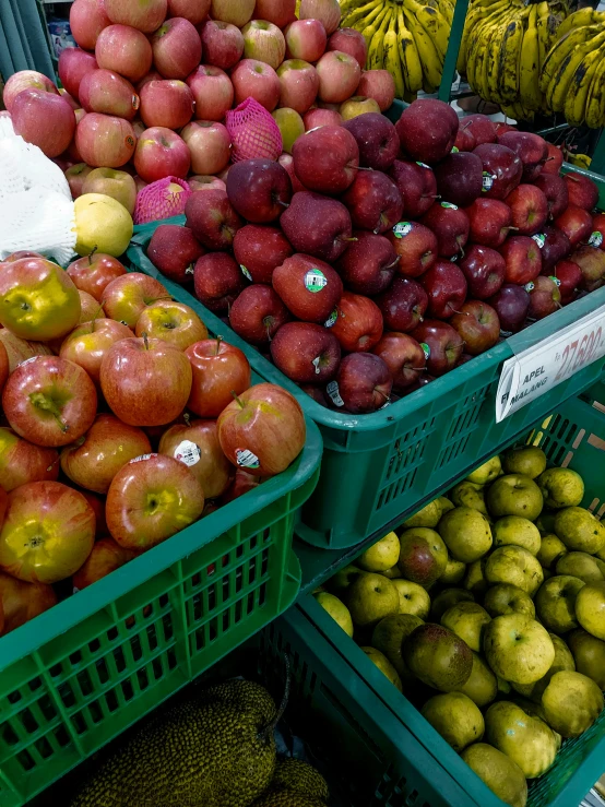 produce is sitting in plastic baskets on display