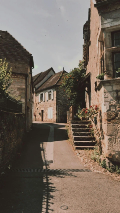 there is an empty street with buildings in the distance