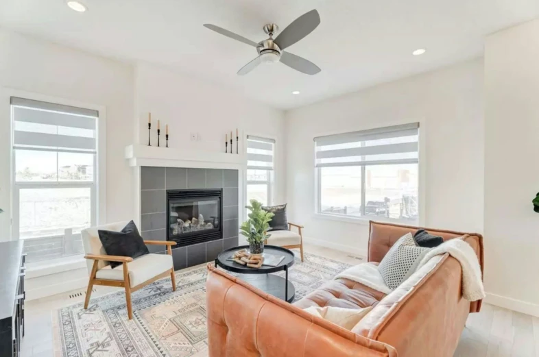 this living room has two chairs and a coffee table with an oriental rug on it