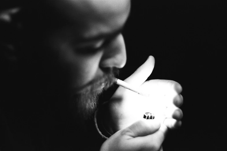 a black and white po of a man with a banana