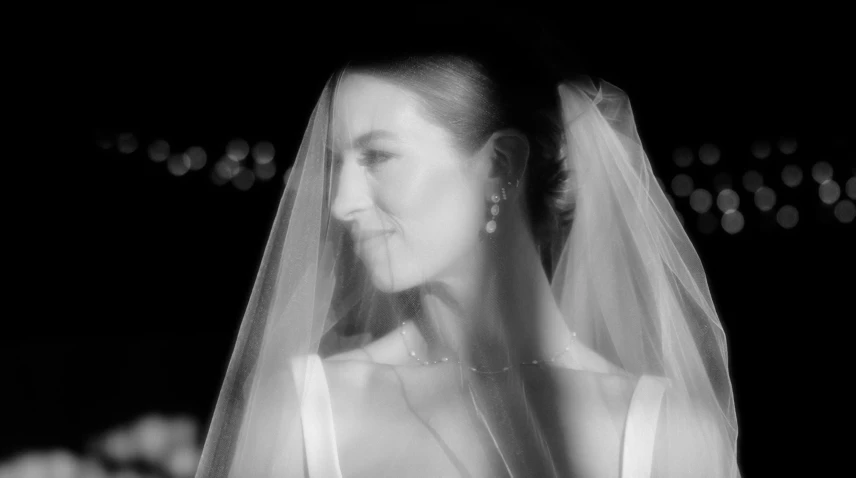 a woman in a wedding dress in a black and white po