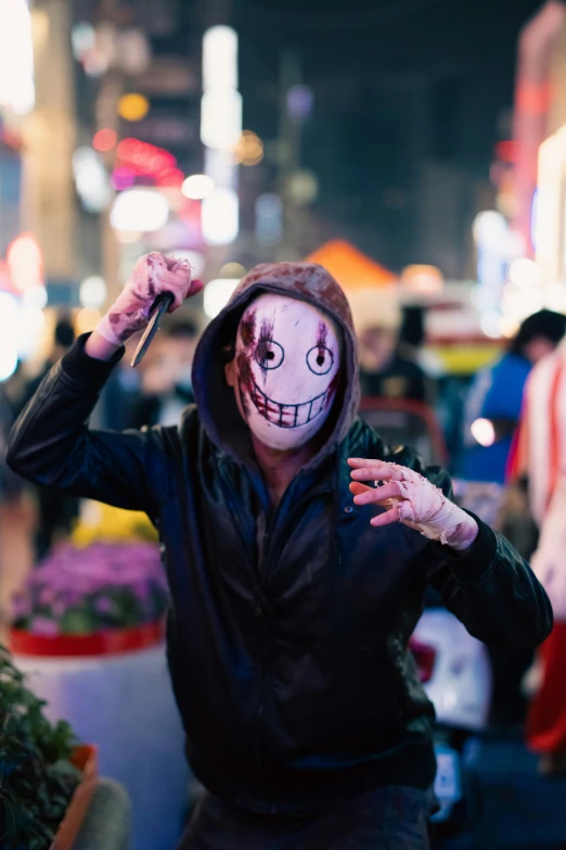 a man wearing a mask and pointing at soing