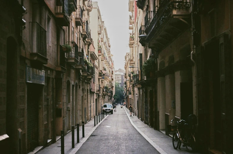 the street is quiet and the buildings are tan