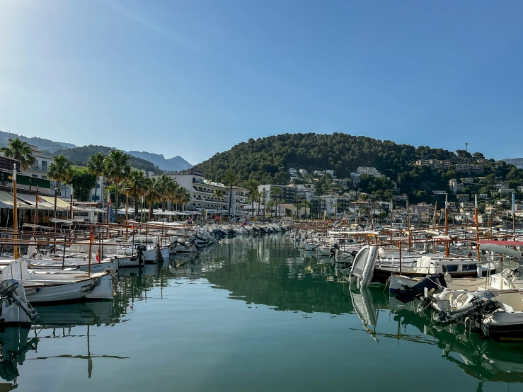 several boats docked at a dock in a marina