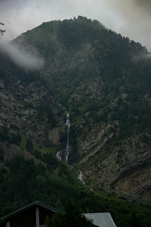 a mountain is seen with fog above it