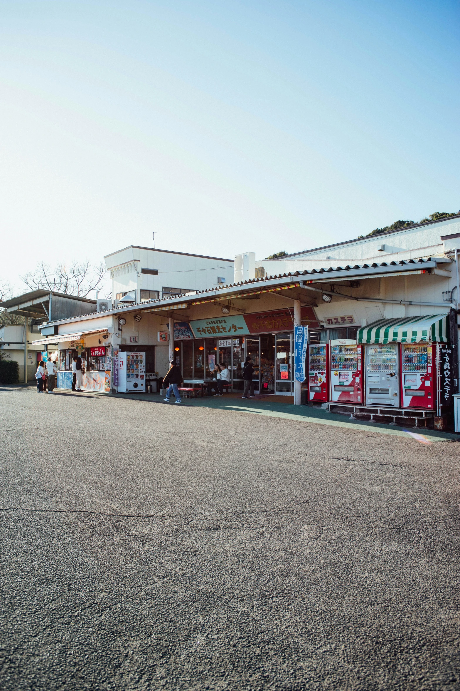 several different shops sit side by side on the street