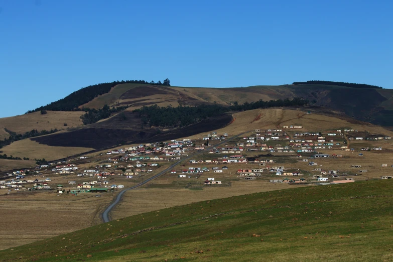 a hill that has a lot of parked cars